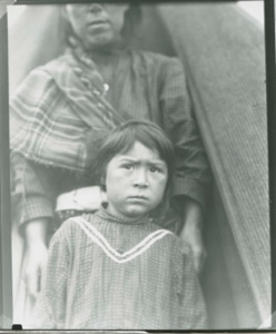 Image of Eskimo [Inuk] girl by mother